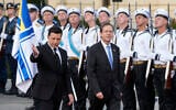 Ukrainian President Volodymyr Zelensky (left) and Israeli President Isaac Herzog review the honor guard during a welcome ceremony ahead of their meeting in Kyiv, Ukraine, on October 5, 2021. (AP Photo/Efrem Lukatsky)