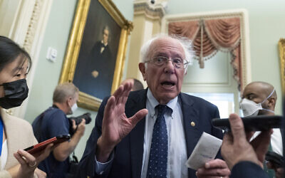 Sen. Bernie Sanders speaks with reporters on Capitol Hill, Thursday, Oct. 7, 2021, in Washington. (AP Photo/Alex Brandon)