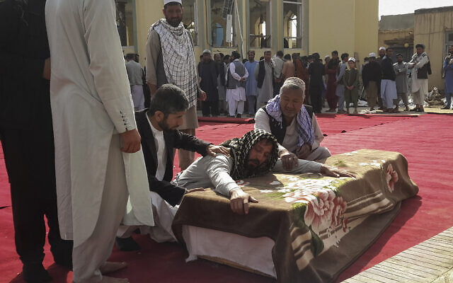 Relatives and residents attend a funeral ceremony for victims of a suicide attack at the Gozar-e-Sayed Abad Mosque in Kunduz, northern Afghanistan, October 9, 2021. (AP Photo/Abdullah Sahil) Relatives and residents attend a funeral ceremony for victims of a suicide attack at the Gozar-e-Sayed Abad Mosque in Kunduz, northern Afghanistan, October 9, 2021. (AP Photo/Abdullah Sahil)