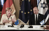 German Chancellor Angela Merkel speaks as she attends a cabinet meeting with Israeli Prime Minister Naftali Bennett in Jerusalem, Sunday, Oct. 10, 2021. (Menahem Kahana/Pool Photo via AP)