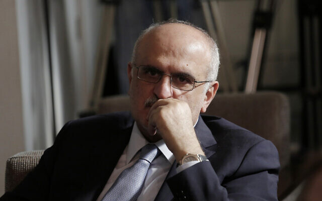 Then-Lebanese Finance Minister Ali Hassan Khalil listens to Lebanese Information Minister Jamal Jarrah while he speaks to a journalist at the Government House in Beirut, Lebanon, May 24, 2019. (AP Photo/Hassan Ammar, File) Then-Lebanese Finance Minister Ali Hassan Khalil listens to Lebanese Information Minister Jamal Jarrah while he speaks to a journalist at the Government House in Beirut, Lebanon, May 24, 2019. (AP Photo/Hassan Ammar, File)