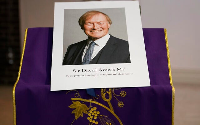 An image of murdered British Conservative lawmaker David Amess is displayed near the altar in St Peters Catholic Church before a vigil in Leigh-on-Sea, Essex, England, Friday, Oct. 15, 2021. (AP/Alberto Pezzali) An image of murdered British Conservative lawmaker David Amess is displayed near the altar in St Peters Catholic Church before a vigil in Leigh-on-Sea, Essex, England, Friday, Oct. 15, 2021. (AP/Alberto Pezzali)