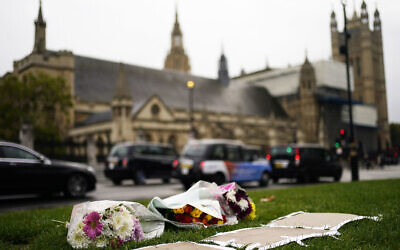 Flowers are placed as a tribute in Parliament Square following Friday's death of member of Parliament David Amess in Leigh-on-Sea, Essex, in London, on October 16, 2021. (Aaron Chown/PA via AP) Flowers are placed as a tribute in Parliament Square following Friday's death of member of Parliament David Amess in Leigh-on-Sea, Essex, in London, on October 16, 2021. (Aaron Chown/PA via AP)