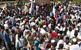 Sudanese protesters take part in a rally demanding the dissolution of the transitional government, outside the presidential palace in Khartoum, Sudan, Saturday, Oct. 16, 2021. (AP Photo/Marwan Ali)