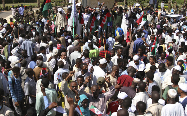 Sudanese protesters take part in a rally demanding the dissolution of the transitional government, outside the presidential palace in Khartoum, Sudan, Saturday, Oct. 16, 2021. (AP Photo/Marwan Ali) Sudanese protesters take part in a rally demanding the dissolution of the transitional government, outside the presidential palace in Khartoum, Sudan, Saturday, Oct. 16, 2021. (AP Photo/Marwan Ali)