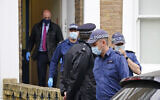 Police search a house believed to be in relation to the slaying of member of Parliament David Amess, in London, October 17, 2021. (Dominic Lipinski/PA via AP)