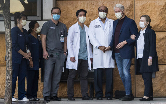 Former US president Bill Clinton (second from right) and former first lady and former US Secretary of State Hillary Clinton (right) thank Alpesh N. Amin, MD (third from left) and the medical staff as he is released from the University of California Irvine Medical Center in Orange, California, October 17, 2021. (AP Photo/Damian Dovarganes) Former US president Bill Clinton (second from right) and former first lady and former US Secretary of State Hillary Clinton (right) thank Alpesh N. Amin, MD (third from left) and the medical staff as he is released from the University of California Irvine Medical Center in Orange, California, October 17, 2021. (AP Photo/Damian Dovarganes)