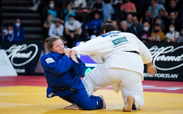Raz Hershko of Israel, in blue, competes against Lea Fontaine of France during the women's +78kg final match at the Grand Slam Paris 2021 Judo tournament, in Paris, France, Sunday, Oct. 17, 2021. (AP Photo/Lewis Joly) Raz Hershko of Israel, in blue, competes against Lea Fontaine of France during the women's +78kg final match at the Grand Slam Paris 2021 Judo tournament, in Paris, France, Sunday, Oct. 17, 2021. (AP Photo/Lewis Joly)