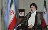 In this photo released by the office of the Iranian Presidency, President Ebrahim Raisi speaks during a live interview in Tehran, Iran, broadcast on state-run TV on Monday, October 18, 2021. (Iranian Presidency Office via AP)