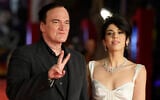 Director Quentin Tarantino, left, and wife Daniella Pick pose on the red carpet for the Lifetime Achievement Award ceremony at the 16th edition of the Rome Film Fest in Rome, October 19, 2021. (AP Photo/Gregorio Borgia)