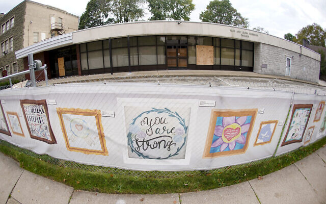 This photo from Oct. 16, 2021, shows the dormant landmark Tree of Life synagogue with the fencing showing artwork submitted by Pittsburgh area school students in Pittsburgh's Squirrel Hill neighborhood. (AP Photo/Keith Srakocic) This photo from Oct. 16, 2021, shows the dormant landmark Tree of Life synagogue with the fencing showing artwork submitted by Pittsburgh area school students in Pittsburgh's Squirrel Hill neighborhood. (AP Photo/Keith Srakocic)