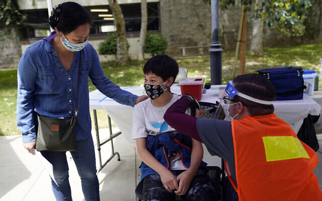 Illustrative: In this May 14, 2021, file photo, an adolescent gets a shot of the Pfizer COVID-19 at the First Baptist Church of Pasadena in Pasadena, Calif. (AP Photo/Marcio Jose Sanchez) Illustrative: In this May 14, 2021, file photo, an adolescent gets a shot of the Pfizer COVID-19 at the First Baptist Church of Pasadena in Pasadena, Calif. (AP Photo/Marcio Jose Sanchez)