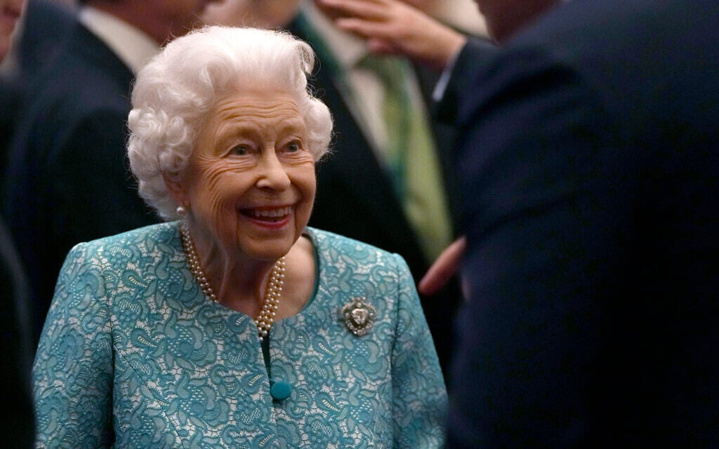 In this October 19, 2021 file photo Britain's Queen Elizabeth II and Prime Minister Boris Johnson, left, greet guests at a reception for the Global Investment Summit in Windsor Castle, Windsor, England (AP Photo/Alastair Grant, Pool, File)