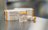 This October 2021 photo provided by Pfizer shows kid-size doses of its COVID-19 vaccine in Puurs, Belgium. (Pfizer via AP)