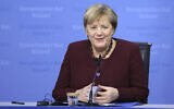 German Chancellor Angela Merkel speaks during a media conference at an EU summit in Brussels, Oct. 22, 2021 (Aris Oikonomou, Pool Photo via AP)