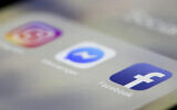 In this file photo from March 13, 2019, Facebook, Messenger and Instagram apps are displayed on an iPhone in New York. (AP/Jenny Kane)