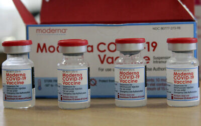 In this file photo from August 15, 2021, vials of the Moderna COVID-19 vaccine are seen at the Assad Iben El Fourat school in Oued Ellil, outside Tunisa. (AP Photo/Hassene Dridi, file)