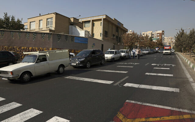 Cars wait in line to fill up at a gas station because pumps machines are out of service, in Tehran, Iran, Tuesday, Oct. 26, 2021. (AP Photo/Vahid Salemi)