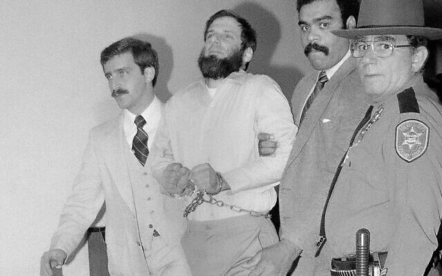 In this Nov. 23, 1981, file photo, law officials escort a handcuffed David Gilbert, second from left, from Rockland County Court in New City, N.Y. (AP/David Handschuh) In this Nov. 23, 1981, file photo, law officials escort a handcuffed David Gilbert, second from left, from Rockland County Court in New City, N.Y. (AP/David Handschuh)