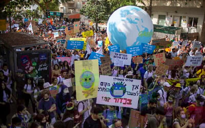 Thousands march through Tel Aviv to call for government action on climate change, on October 29, 2021. (AP Photo/Ariel Schalit)