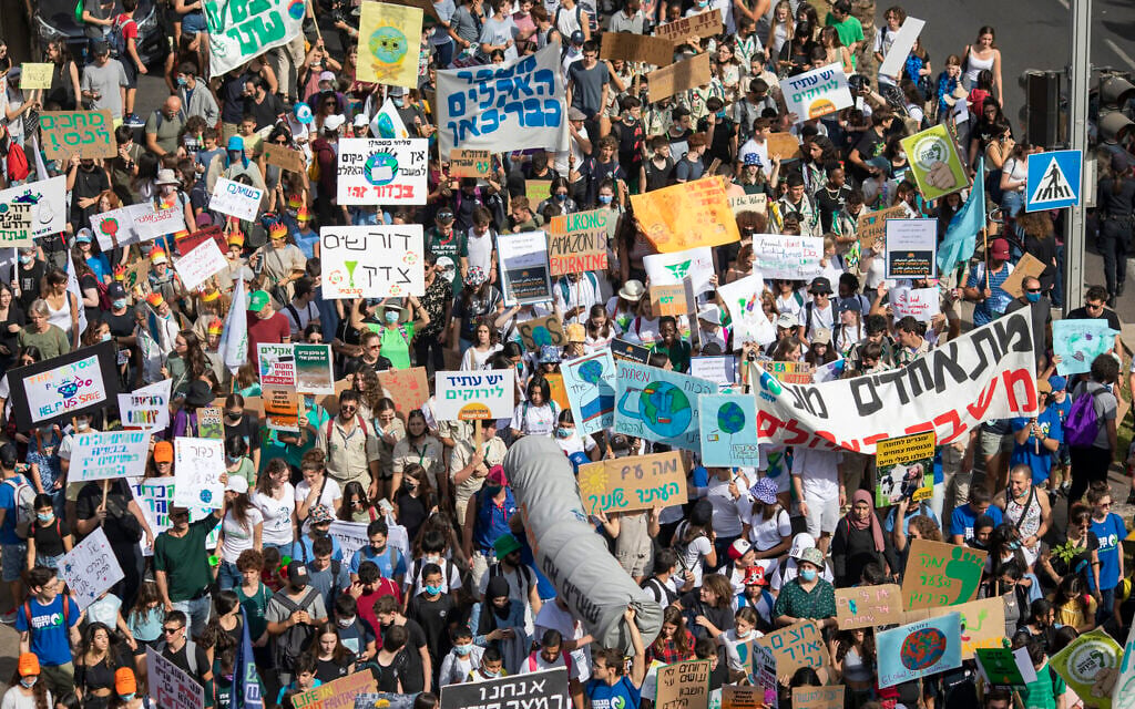Thousands march through Tel Aviv to call for government action on climate change, October 29, 2021. (AP Photo/Ariel Schalit)