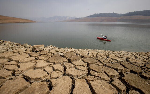 A kayaker fishes in Lake Oroville as water levels remain low due to continuing drought conditions in Oroville, Calif., August 22, 2021. (AP Photo/Ethan Swope) A kayaker fishes in Lake Oroville as water levels remain low due to continuing drought conditions in Oroville, Calif., August 22, 2021. (AP Photo/Ethan Swope)