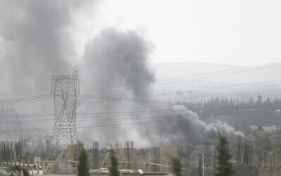 Smoke rises in the countryside of Damascus, Syria, on October 30, 2021, following what Syrian state media said was an Israeli strike. (AP Photo/Omar Sanadiki)