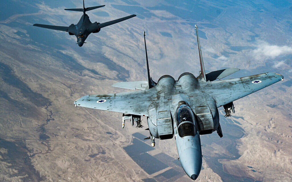 In this photo released by the US Air Force, an Israeli Air Force F-15 Strike Eagle flies in formation with a US Air Force B-1B Lancer over Israel as part of a deterrence flight Saturday, October 30, 2021. (US Air Force/Senior Airman Jerreht Harris via AP) In this photo released by the US Air Force, an Israeli Air Force F-15 Strike Eagle flies in formation with a US Air Force B-1B Lancer over Israel as part of a deterrence flight Saturday, October 30, 2021. (US Air Force/Senior Airman Jerreht Harris via AP)