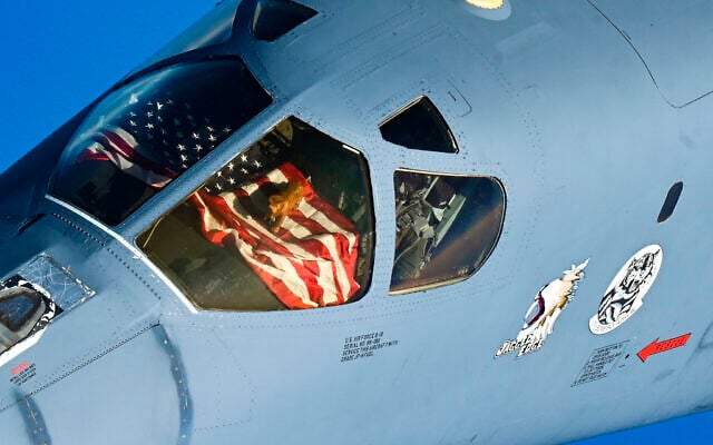 In this photo released by the U.S. Air Force, the crew of a U.S. Air Force B-1B Lancer display their mascot from the cockpit window over the Middle East Saturday, Oct. 30, 2021. The U.S. Air Force said Sunday it flew a B-1B strategic bomber over key maritime chokepoints in the Mideast with allies including Israel amid ongoing tensions with Iran as its nuclear deal with world powers remains in tatters. (U.S. Air Force/Senior Airman Jerreht Harris via AP)