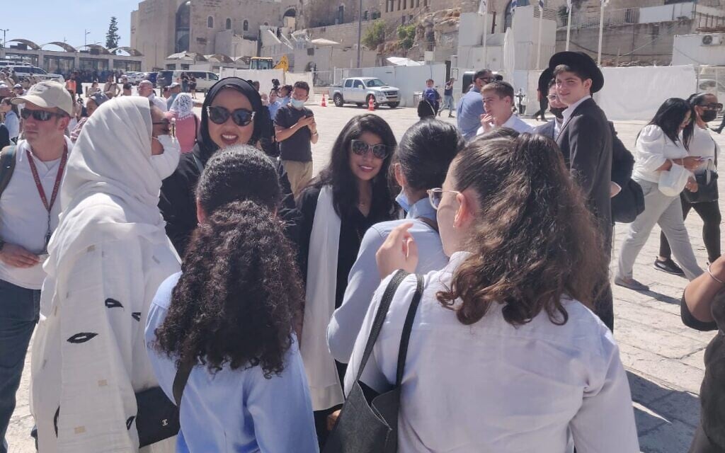 Bahrainis speak with Haredi schoolgirls in the Old City of Jerusalem, October 6, 2021 (Lazar Berman, Times of Israel)