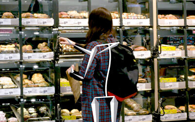 A shopper selects items at a REWE store in Cologne, Germany, that has been outfitted with Trigo's checkout-free, grab-and-go technology. (REWE)