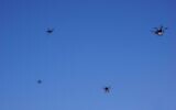 Drones flying near the city of Tel Aviv on October 11, 2021, in a pilot run by the Israel Innovation Authority with partners to create a network of drone deliveries in Israel. (Emanuel Fabian/Times of Israel)