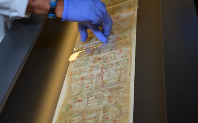 Preparing the Florence Scroll for display at the Israel Museum exhibit, Painting a Pilgrimage (Courtesy Israel Museum) Preparing the Florence Scroll for display at the Israel Museum exhibit, Painting a Pilgrimage (Courtesy Israel Museum)