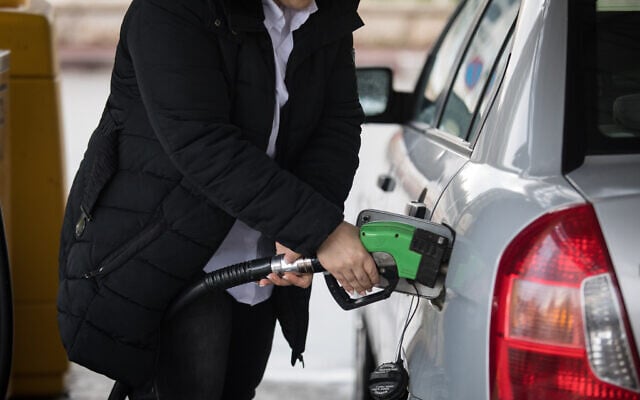 Illustrative: A woman fills her car's gas tank, at a gas station in Jerusalem, on March 31, 2019. (Hadas Parush/Flash90) Illustrative: A woman fills her car's gas tank, at a gas station in Jerusalem, on March 31, 2019. (Hadas Parush/Flash90)