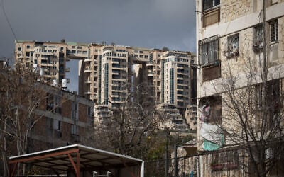 View of the Holyland high-rise buildings next to older apartment buildings in the Gonen neighborhood of Jerusalem, January 19, 2020. (Hadas Parush/Flash90)