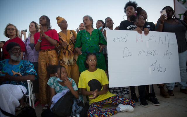 Members of the Black Hebrews community protest against the deportation orders given to some members of the community, at Habima Square in Tel Aviv, June 1, 2021. (Miriam Alster/Flash90) Members of the Black Hebrews community protest against the deportation orders given to some members of the community, at Habima Square in Tel Aviv, June 1, 2021. (Miriam Alster/Flash90)
