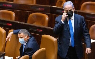 Benjamin Netanyahu and Yuli Edelstein are seen in the plenum hall of the Knesset, in Jerusalem, on June 2, 2021. (Olivier Fitoussi/Flash90)
