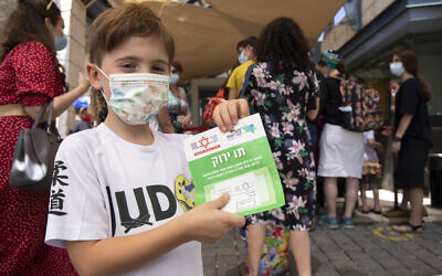 Children are eligible for a Green Pass due to testing negative for coronavirus (PCR swab test) in the last 24 hours, they will be included in their parents' Green Pass. (Courtesy Olivier Fitoussi/Flash90)