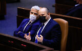 Prime Minister Naftali Bennett (right) and Foreign Minister Yair Lapid speak at the Knesset, on September 2, 2021. (Olivier Fitoussi/Flash90)