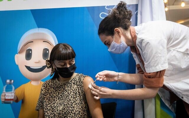 A woman receives a dose of the COVID-19 vaccine in Jerusalem, September 30, 2021 (Yonatan Sindel/Flash90) A woman receives a dose of the COVID-19 vaccine in Jerusalem, September 30, 2021 (Yonatan Sindel/Flash90)