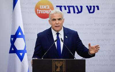 Yesh Atid party leader Yair Lapid speaks during a faction meeting at the Knesset on October 4, 2021. (Olivier Fitoussi/Flash90)