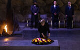 German chancellor Angela Merkel lays a wreath at the Yad Vashem Holocaust Memorial museum in Jerusalem on October 10, 2021. (Olivier Fitoussi/Flash90)