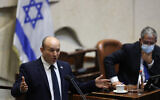 Prime Minister Naftali Bennett addresses the Knesset plenum on October 11, 2021. (Yonatan Sindel/Flash90)