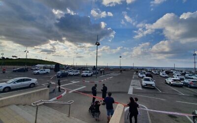 Illustrative -- Medics and police officers are seen near the scene of a shooting at Jaffa's port, October 23, 2021. (Magen David Adom)