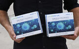 Some of the millions of coronavirus antigen testing kits that arrived in Israel on October 12, 2021. (Haim Zach / GPO)