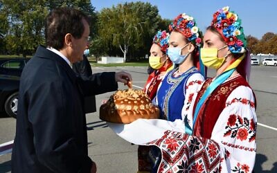 President Isaac Herzog is greeted at a  welcoming ceremony as he arrives in Ukraine for an official visit, October 5, 2021. (Haim Zach/GPO)