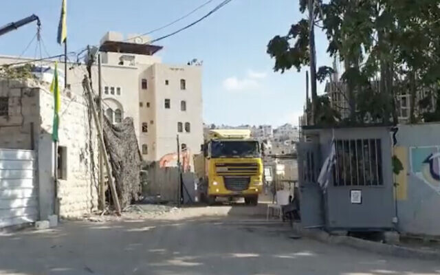 This screenshot from video released by Peace Now on October 21, 2021, shows construction on new settlement units in the West Bank city of Hebron. (Screenshot/Twitter) This screenshot from video released by Peace Now on October 21, 2021, shows construction on new settlement units in the West Bank city of Hebron. (Screenshot/Twitter)