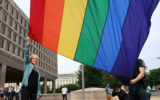 US Energy Secretary Jennifer Granholm raises the Pride Flag for the first time outside the Department of Energy on June 2, 2021. (Kevin Dietsch GETTY IMAGES NORTH AMERICA/AFP/File)