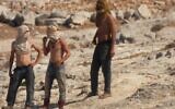 Masked settlers near the Palestinian hamlet of al-Mufaqara in the South Hebron Hills, on Tuesday, September 28, 2021. (Courtesy)