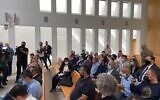 Palestinians sit in a courtroom hearing on evictions in East Jerusalem at Israel's High Court on Monday, October 25, 2021 (Aaron Boxerman/The Times of Israel)
